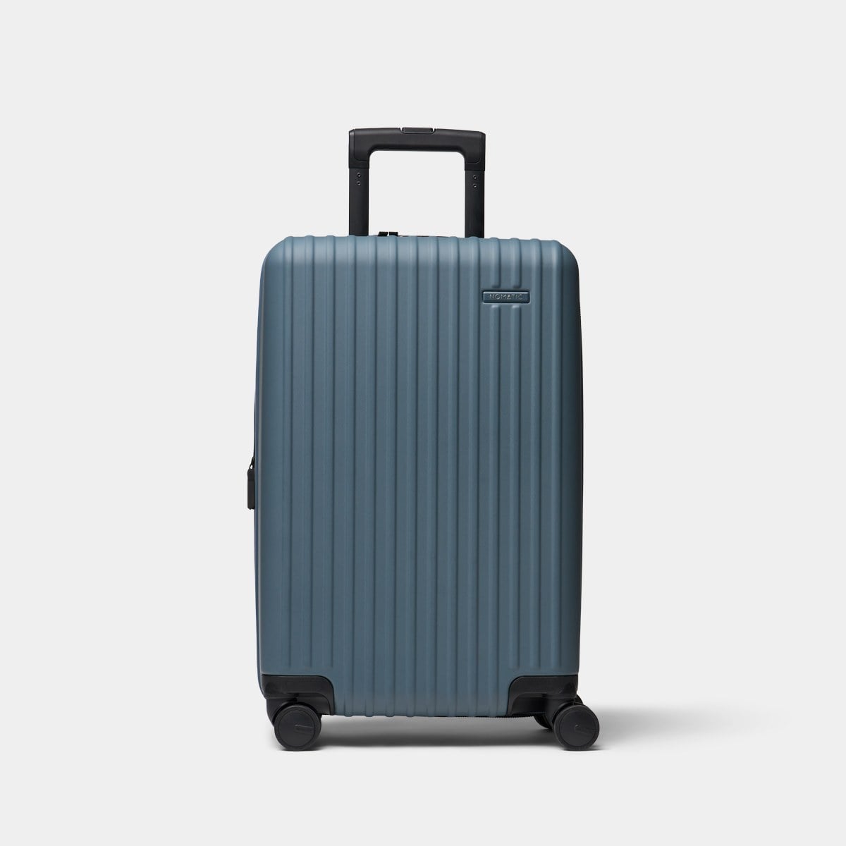 Nomatic Method Luggage Carry-On in slate grey, a ribbed polycarbonate hard-shell spinner case with telescopic handle