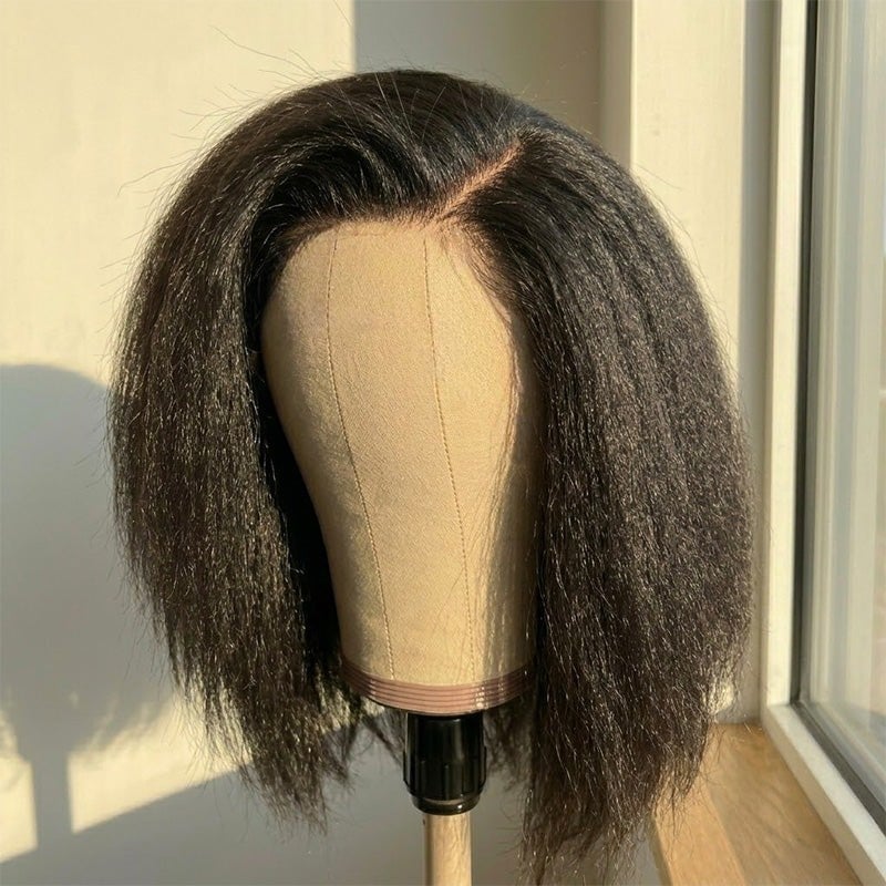 Natural black kinky straight Amanda Hair bob wig with a 7x5 lace closure on a mannequin head by a window
