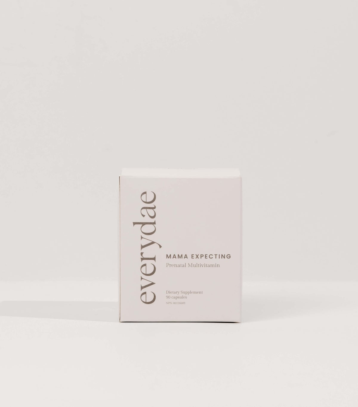 Pale pink Everydae Mama Expecting prenatal multivitamin box on a neutral background
