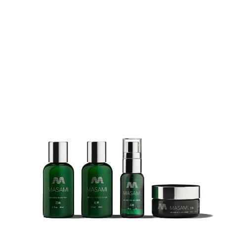 MASAMI Mekabu Hydrating Haircare Travel Kit with travel-size shampoo, conditioner, shine serum pump bottle and styling cream jar in dark green packaging